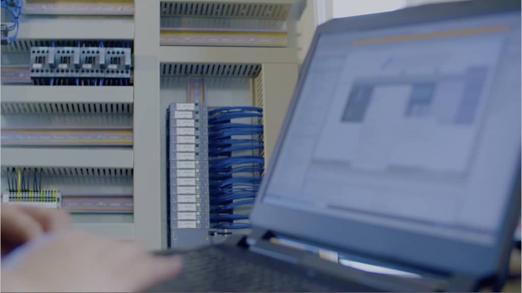 A technician is working on a computer in the electronics workshop.